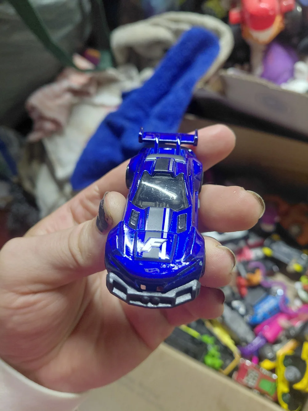 1:64 scale Hot Wheels Track Ripper in metallic blue